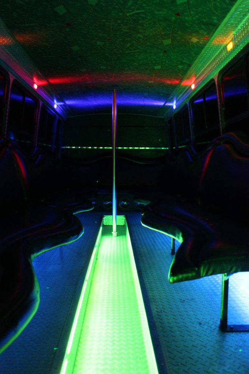 Party bus aisle lit with green LED floor lighting