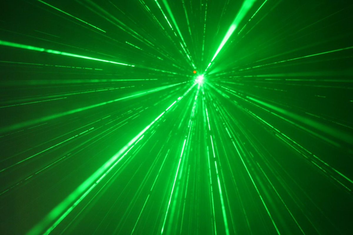 Green laser display filling a party bus interior