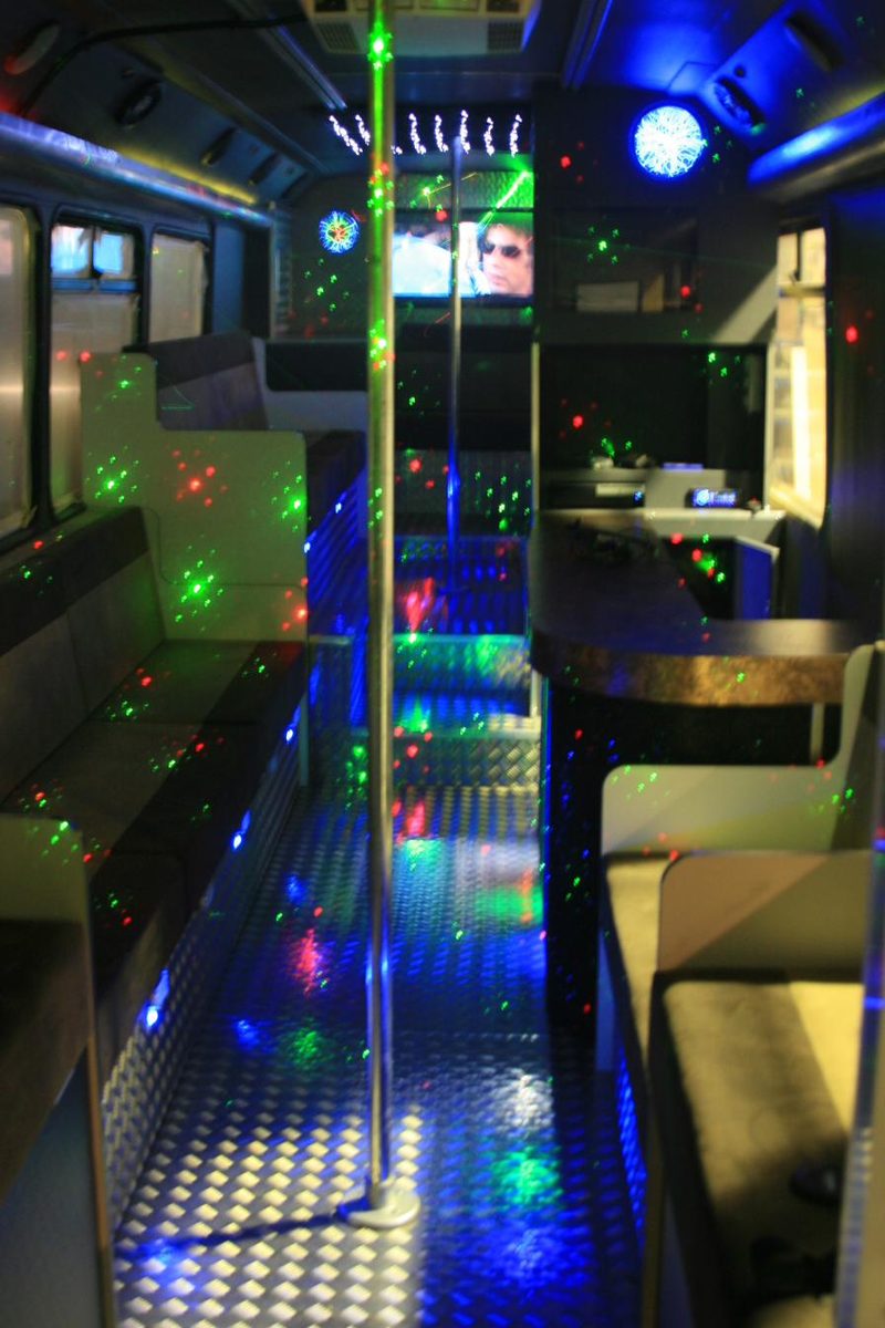 Party bus lounge seating with coloured lighting
